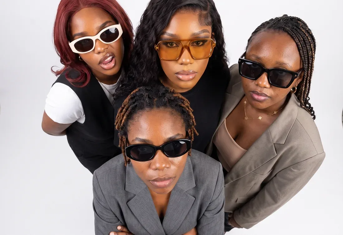 The four women of the Blizsocials team photographed from above in the studio